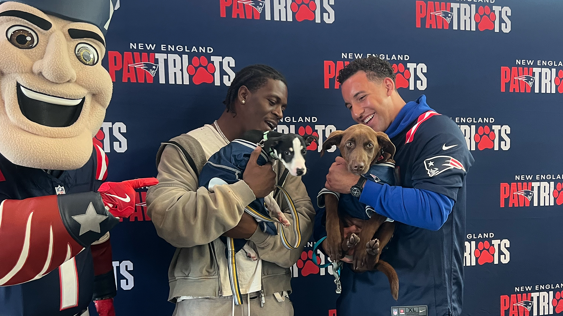 Terrell Jennings, Julian Ashby each 'draft' new furry friend at Pawtriots Dog Adoption & Draft Watch Party